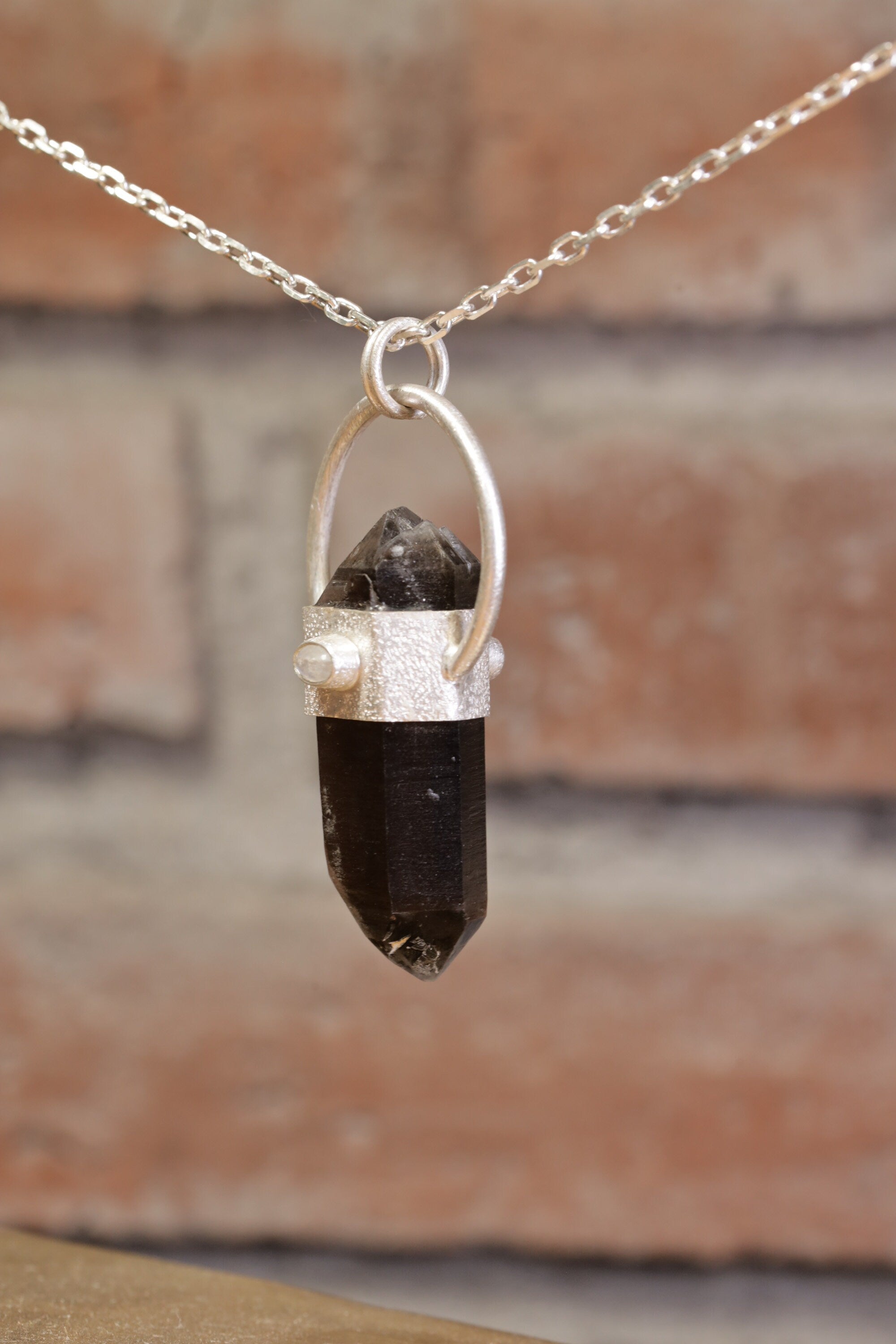 Smokey Luminescence: Sterling Silver Sand-Textured Crystal Pendant with Double Terminated Smoky Cathedral Quartz from Glen Innes & Moonstone